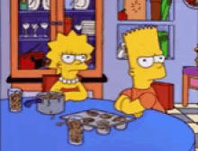Lisa and Bart Simpson sitting at the kitchen table, arms folded, both shaking their heads to say 'no'